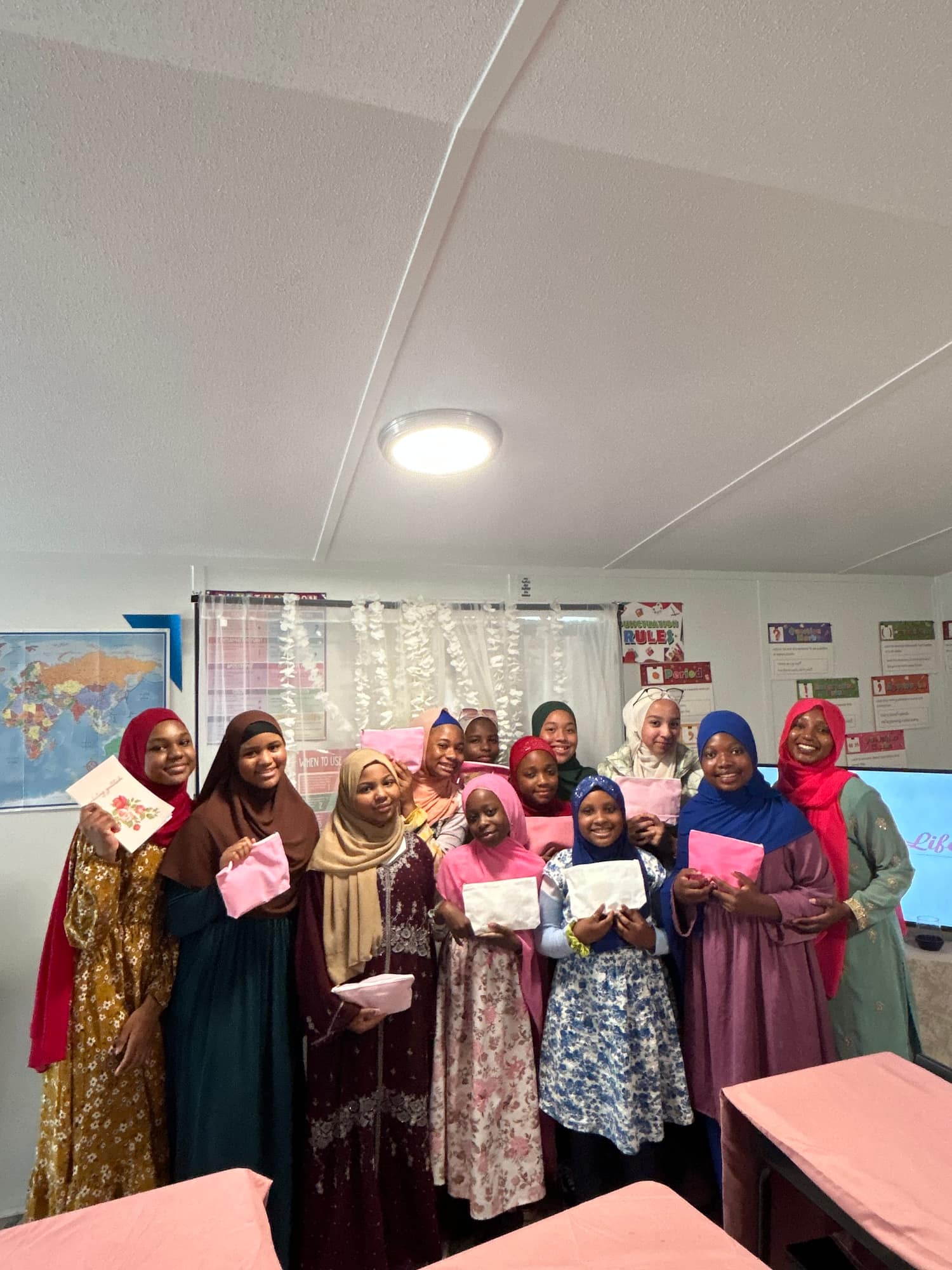 The girls together at the end of the Girl Talk session, holding their cards
