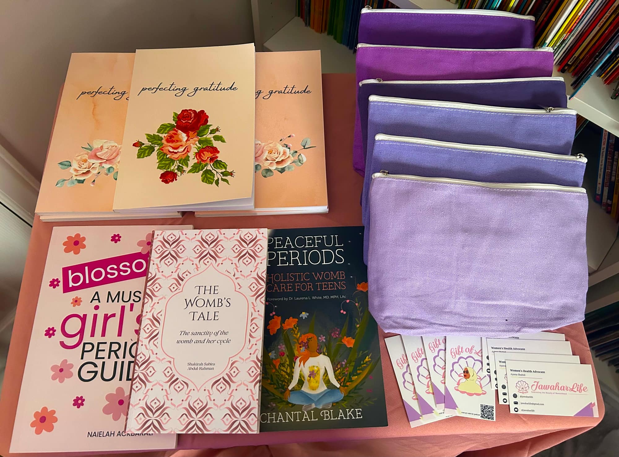 Books and lilac pouches laid out on the table for the girls