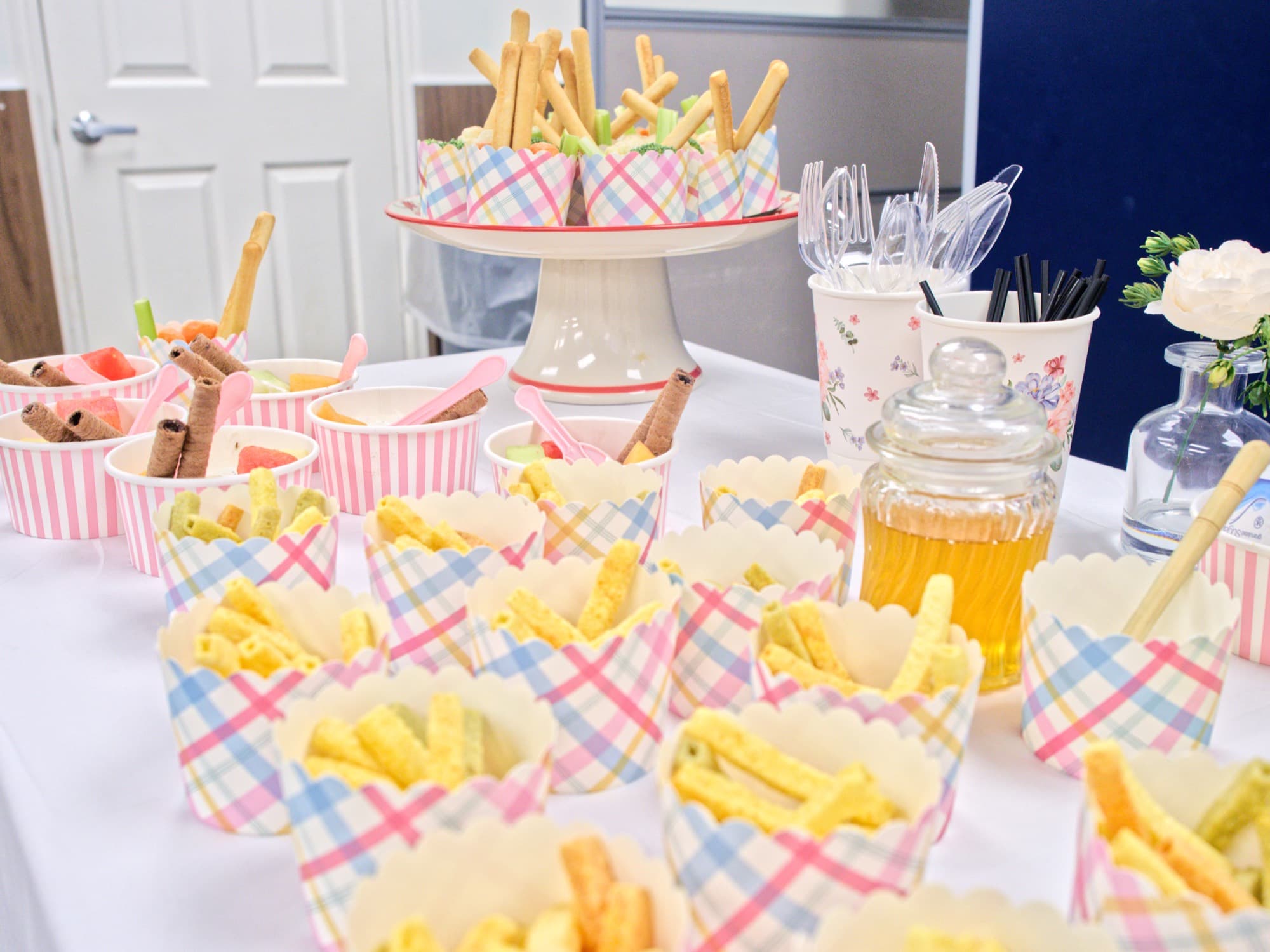 Table of refreshments in pastel paper cups